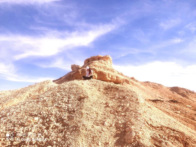 Low angle view of rock formations against sky