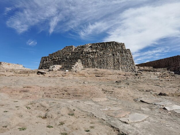 Low angle view of rock formations against sky