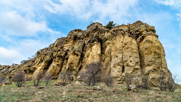 Low angle view of rock formations against sky