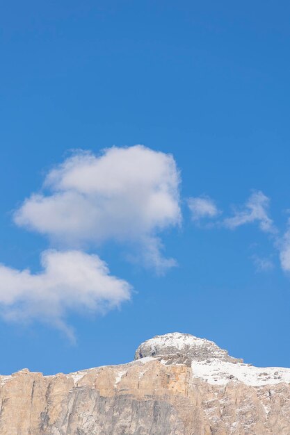 Low angle view of rocks against blue sky