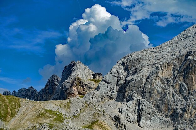 Low angle view of rocks on mountain against sky