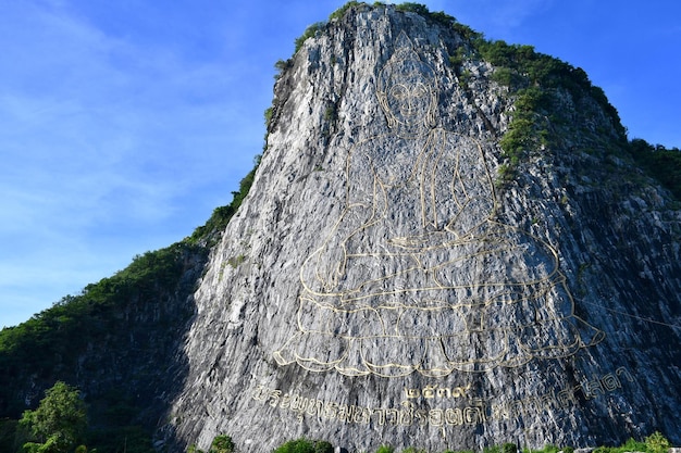 Low angle view of rocky mountain against sky