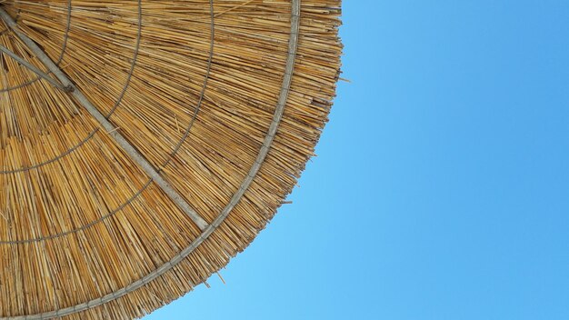 Low angle view of roof against clear blue sky