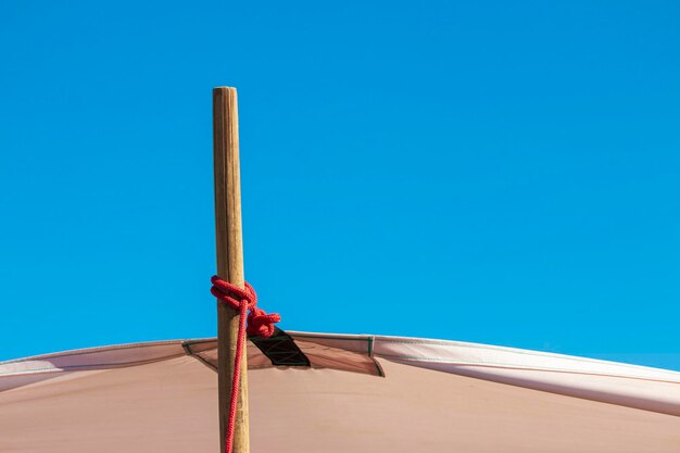 Low angle view of roof against clear blue sky