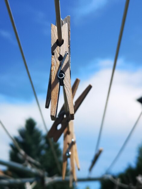 Low angle view of rope against blue sky