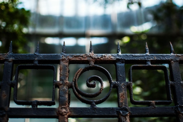 Low angle view of rusty metallic fence