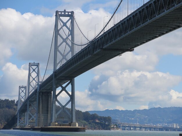 Low angle view of san francisco-oakland bay bridge against sky