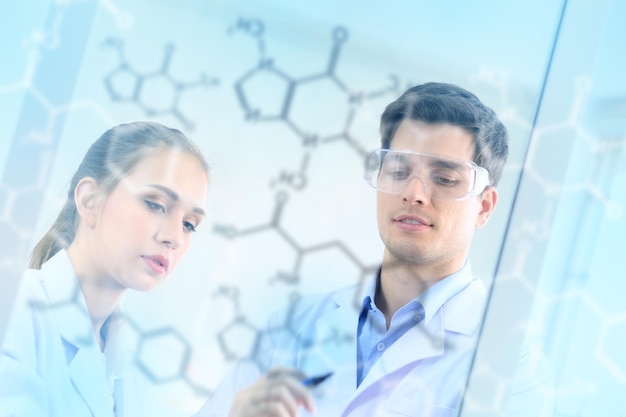 Low angle view of scientists discussing in laboratory