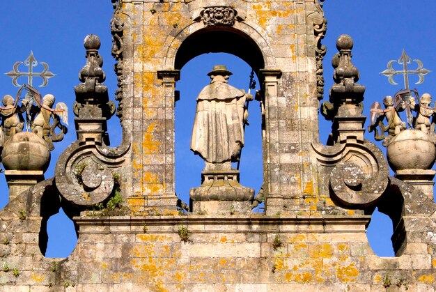 Low angle view of sculptures on building against sky