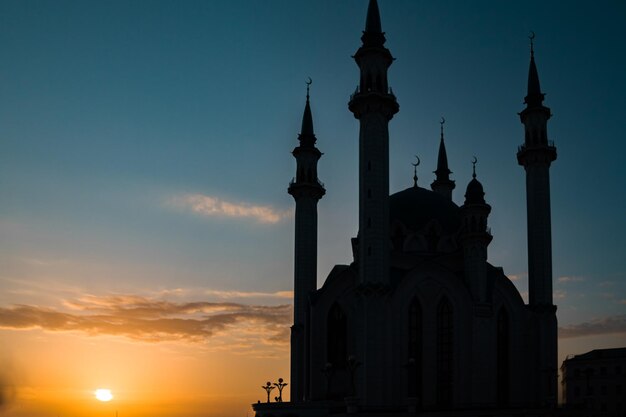 Low angle view of silhouette building against sky during sunset