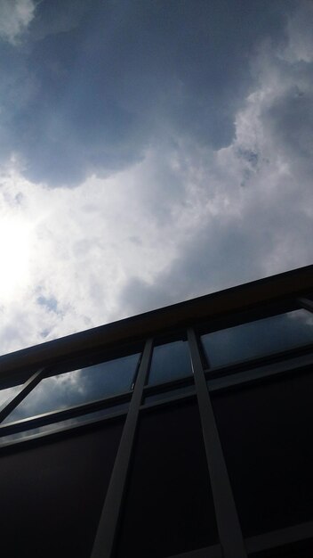 Low angle view of silhouette building against sky