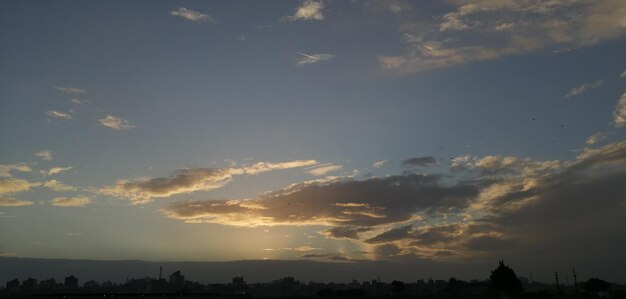 Low angle view of silhouette buildings against sky during sunset