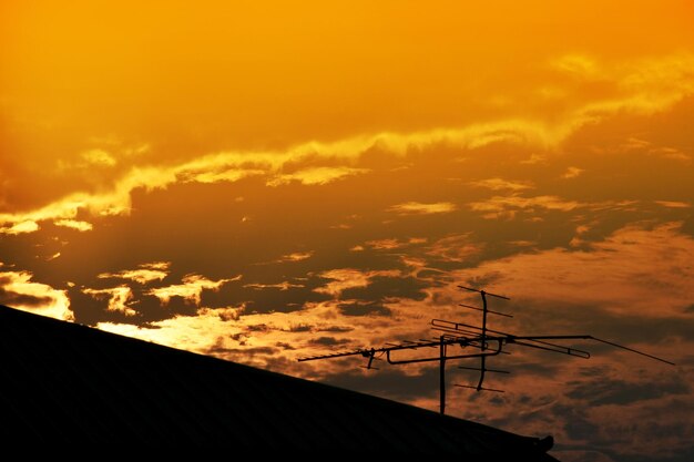 Low angle view of silhouette buildings against sky during sunset