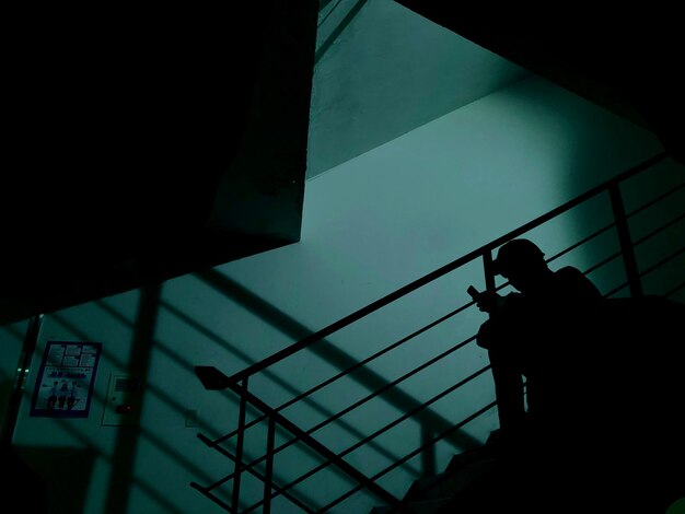 Low angle view of silhouette man in building