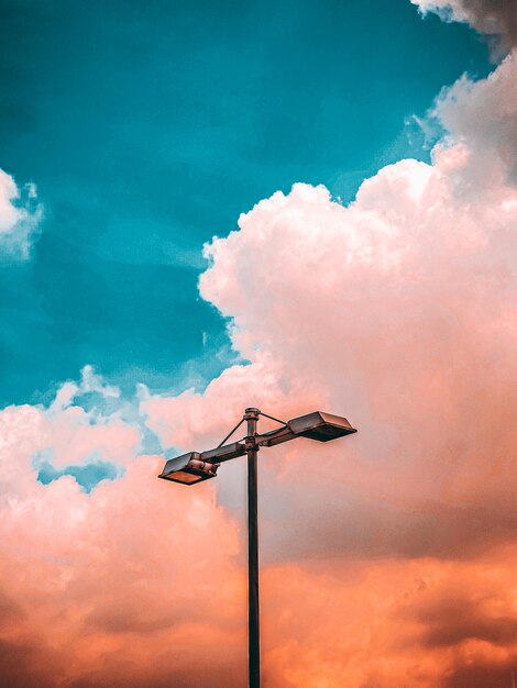 Low angle view of silhouette street light against sky during sunset