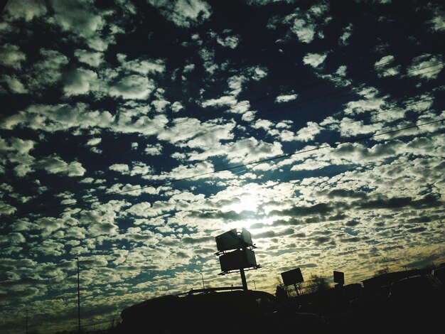 Low angle view of silhouette tree against sky