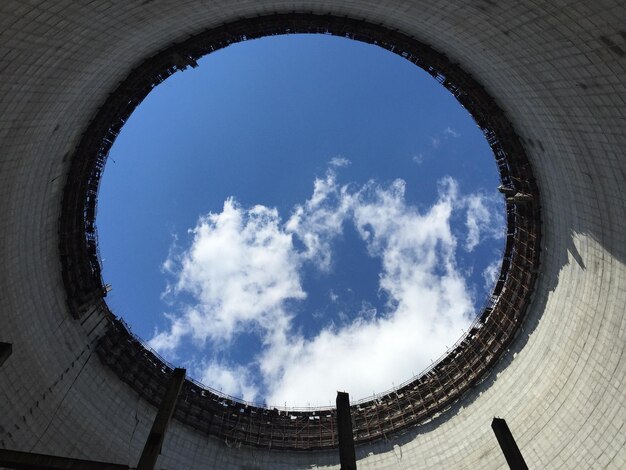 Low angle view of sky seen through cooling tower