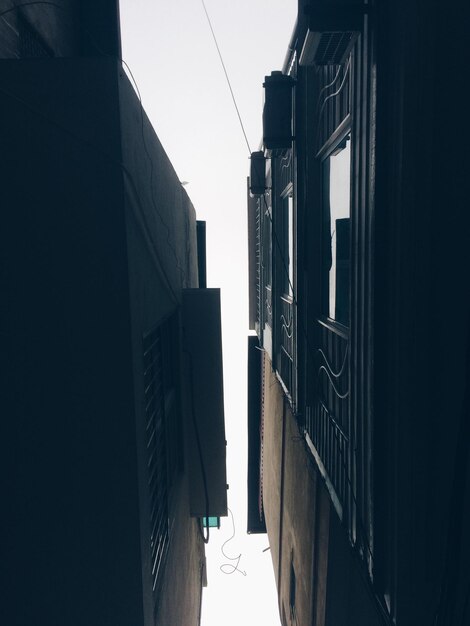 Low angle view of skyscrapers against clear sky