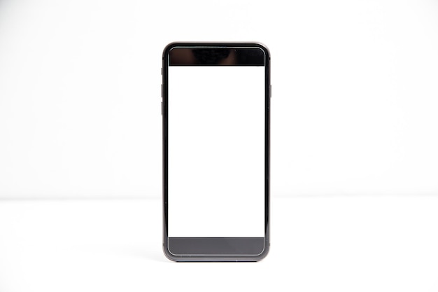 Low angle view of smart phone against white background