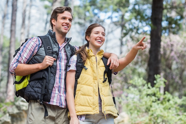 Low angle view of smiling couple looking away 