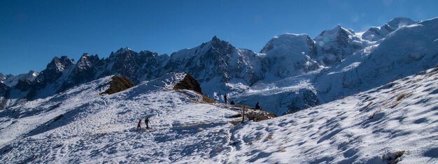 Low angle view of snow covered mountain against sky