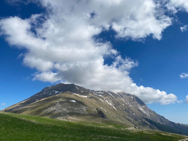 Low angle view of snowcapped mountain against sky