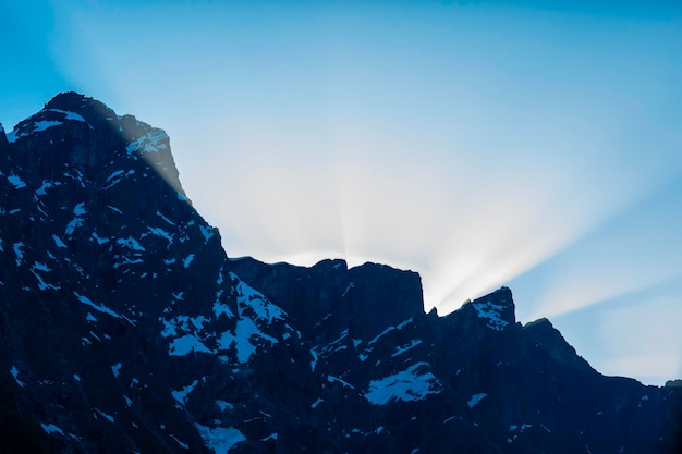 Low angle view of snowcapped mountains against sky