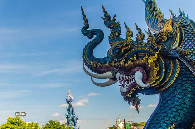 Low angle view of statue against blue sky