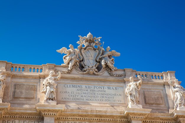 Low angle view of statue against blue sky