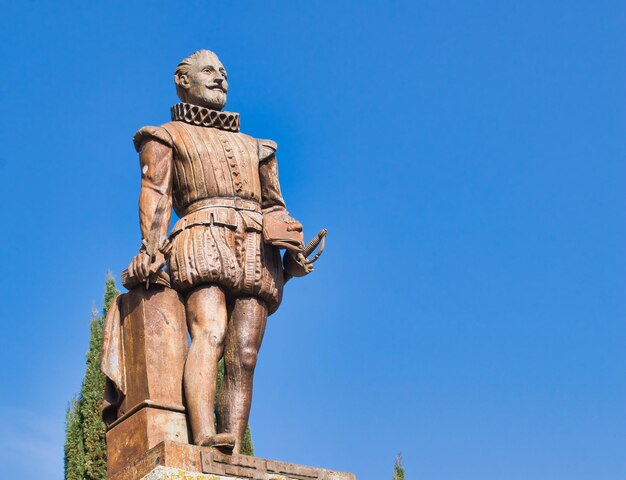 Low angle view of statue against blue sky