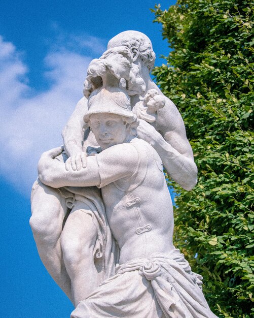 Low angle view of statue against blue sky