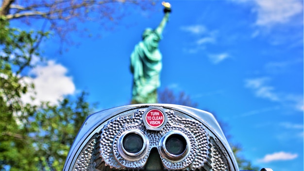 Low angle view of statue against blue sky