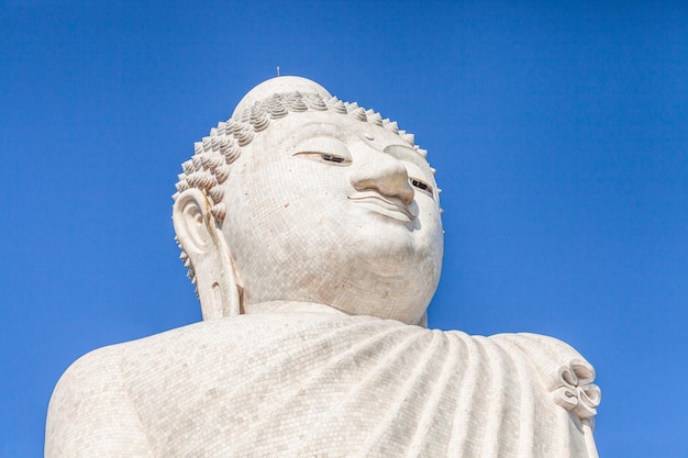 Low angle view of statue against blue sky