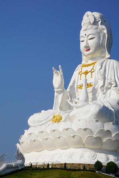 Low angle view of statue against blue sky