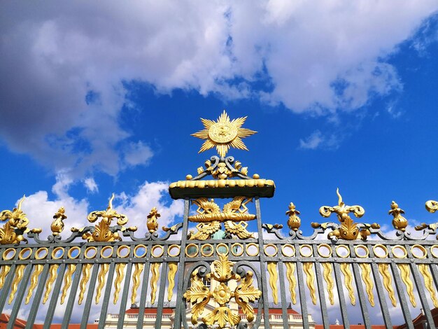 Low angle view of statue against blue sky