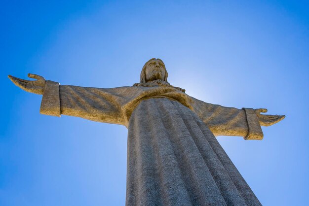 Low angle view of statue against blue sky