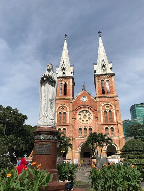 Low angle view of statue against church