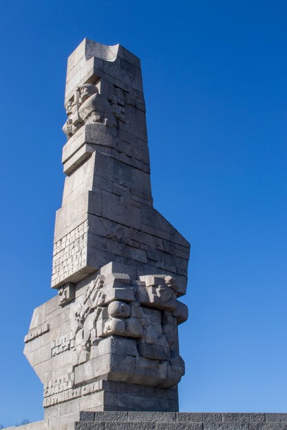 Low angle view of statue against clear blue sky - westerplatte