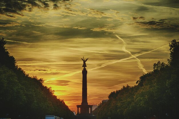 Low angle view of statue against cloudy sky