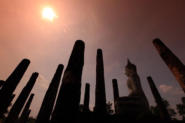 Low angle view of statue against sky during sunset