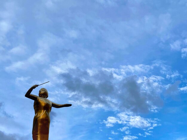 Low angle view of statue against sky