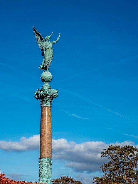 Low angle view of statue against sky