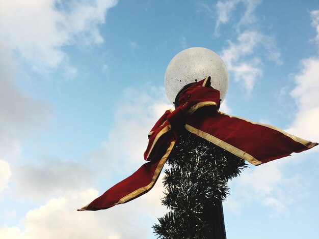 Low angle view of statue against sky