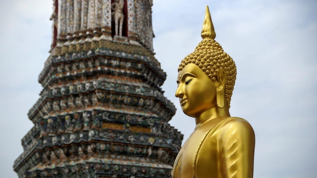 Low angle view of statue against temple against sky