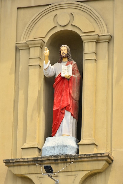 Low angle view of statue against temple building