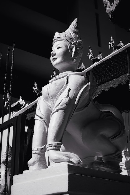 Low angle view of statue against temple