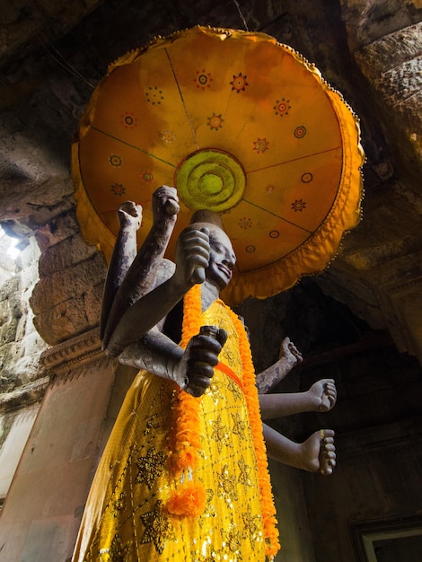 Low angle view of statue against temple