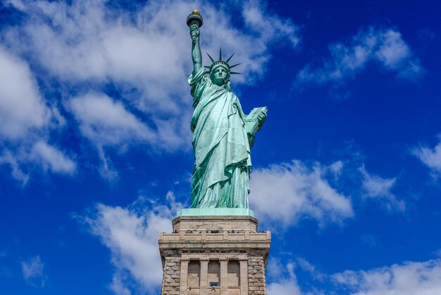 Low angle view of statue of liberty against sky