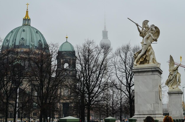 Low angle view of statues against church in city