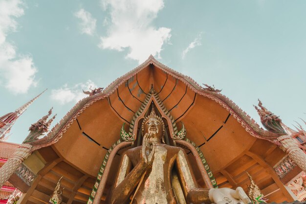 Low angle view of statues on building against sky